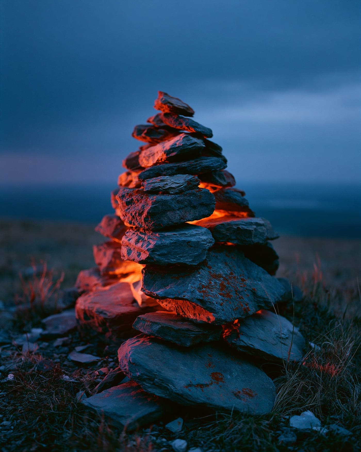 A stone cairn at golden hour — Cairn Studio, Calgary